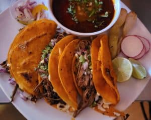 Tacos with side sauce and garnish from Los Gallos in Philly