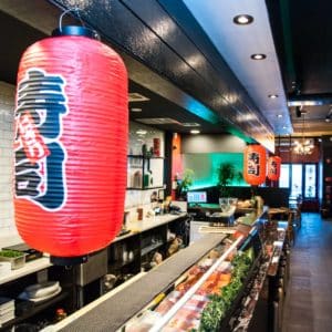 Lantern and loaded sushi bar at Megumi Japanese Ramen & Sushi Bar in Philadelphia